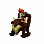 Ganesha Idol Reading Book on Wooden Chair